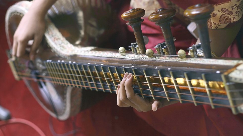 person playing sitar